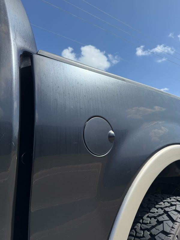 F-150 bed side and fuel door, chalky and faded before correction