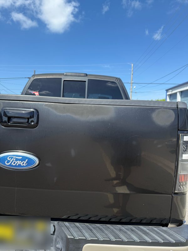Faded, chalky F-150 tailgate before correction