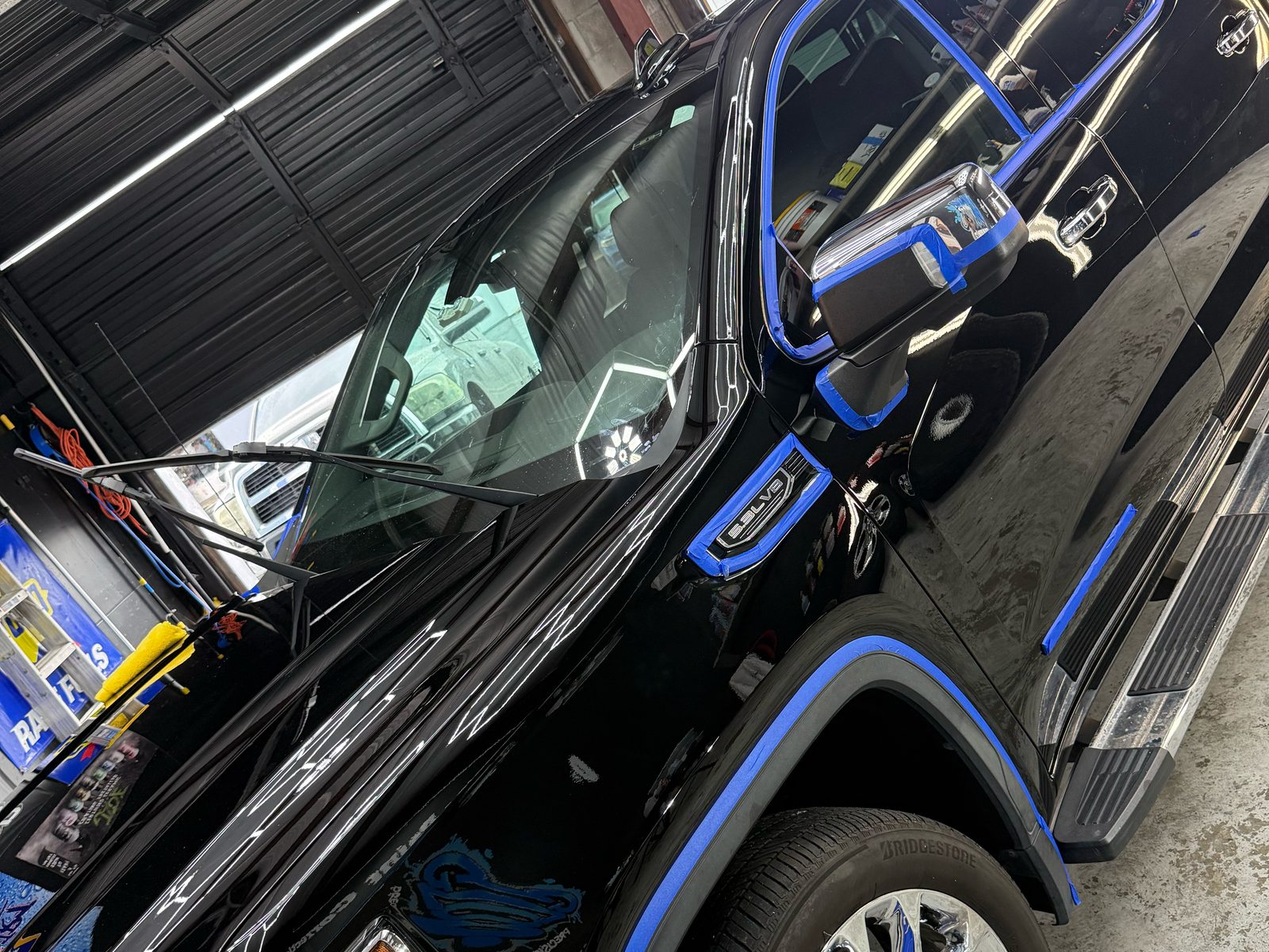 Black Sierra masked in blue tape