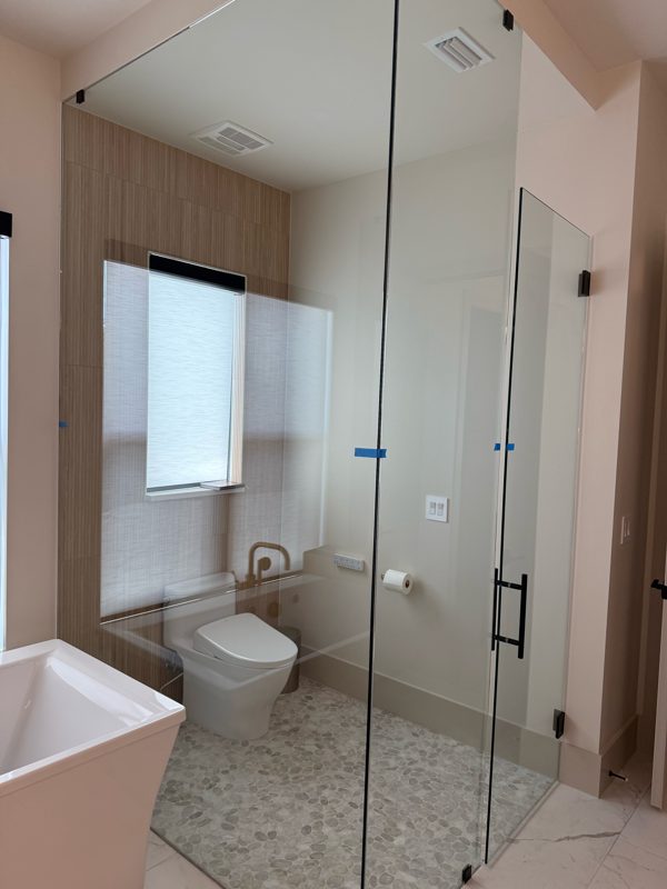Clear glass shower enclosure before film
