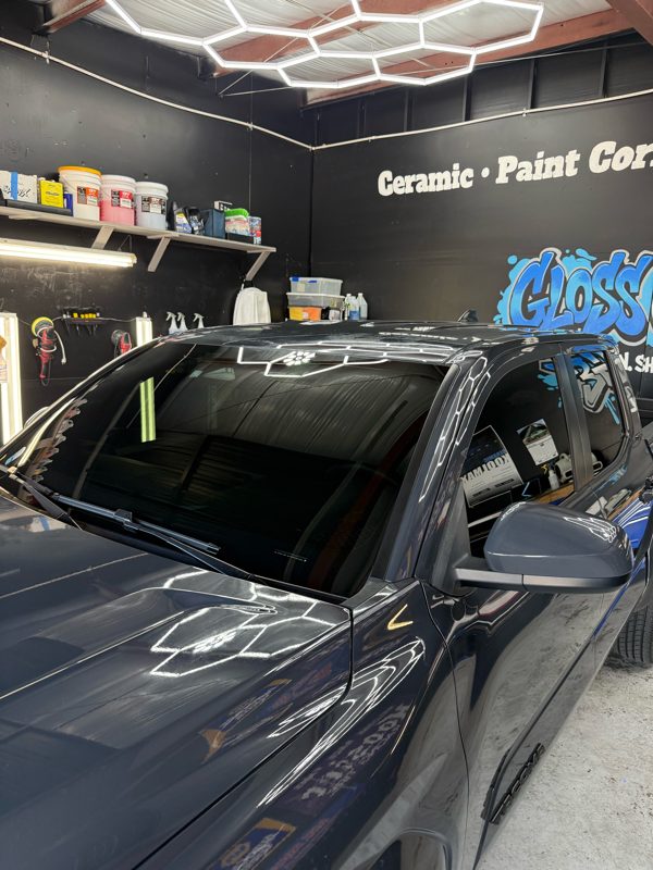 Gray pickup windshield in the Gloss Garage bay