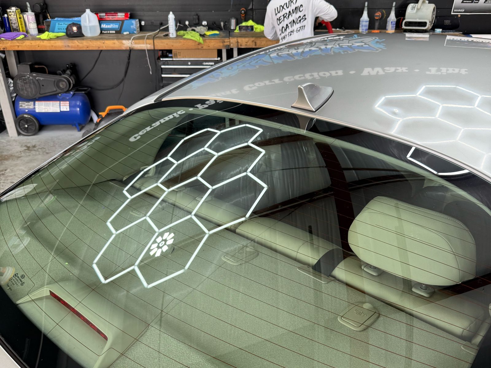 Rear window film being installed